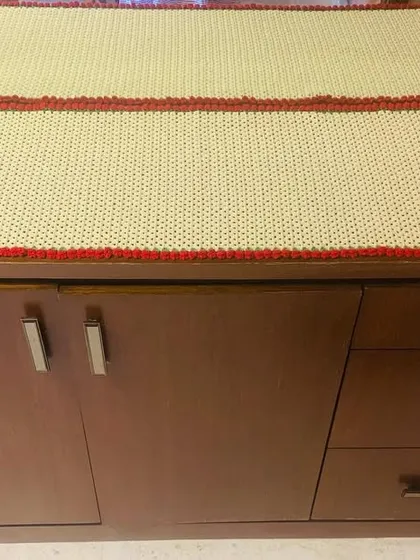 Another view of the custom side table runner, showing how it perfectly covers the surface of the cabinet.