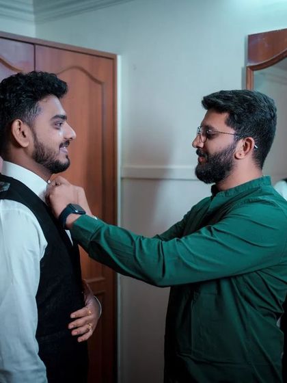 A duplicate of 123, a great behind-the-scenes shot of the groom.