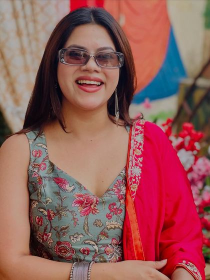 A happy, smiling close-up from a Mehendi event. The joy of the celebration is truly infectious.