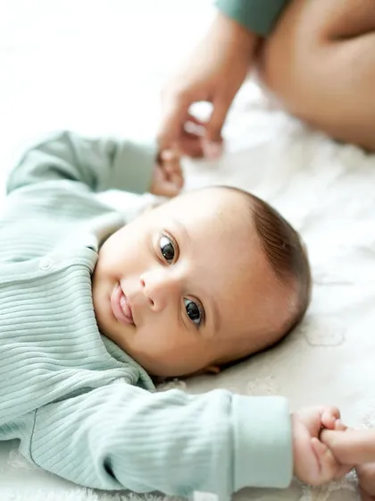 A newborn's curious gaze. We also capture those precious moments when your baby is awake, making eye contact and connecting with the world around them.