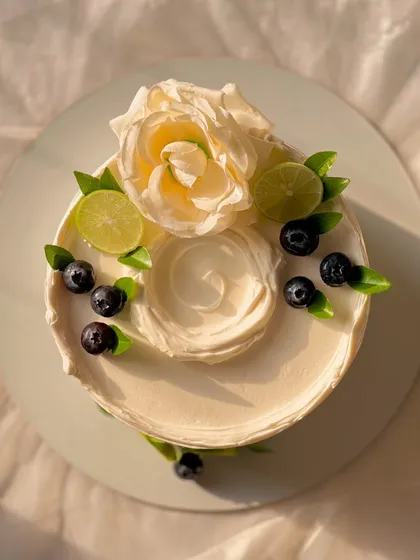 My most popular creation, the signature Italian Lemon & Blueberry cake. I offer many design variations, all featuring fresh blueberries, zesty lime, and smooth buttercream.