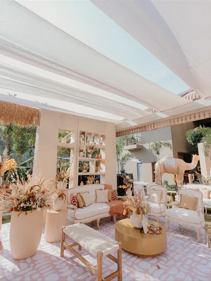 Another angle of the 'Desert Oasis' lounge, highlighting the different seating options I provide, from benches to sofas, ensuring guest comfort without compromising on style.