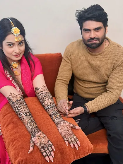 Another angle of this beautiful bridal mehandi. The design tells a story with traditional motifs covering the hands and arms.