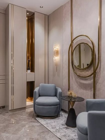 This elegant entrance foyer combines modern luxury with thoughtful details. The round niche, highlighted by gold elements, serves as a striking focal point, seamlessly integrating decor with architecture.