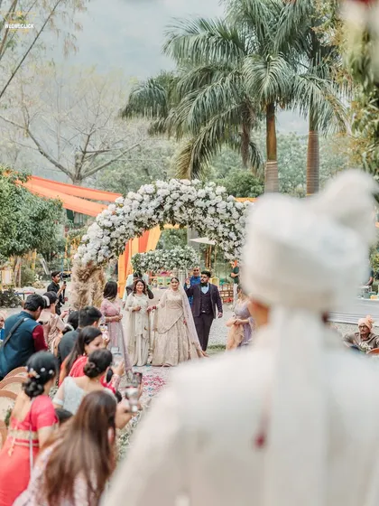 The groom's perspective as he watches his bride walk down the aisle, a moment filled with love and anticipation.