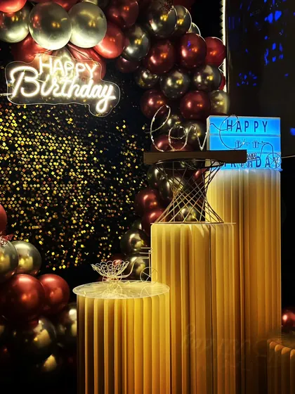 The magic is in the details. This close-up shows how I layer different lighting elements like neon signs and marquee letters against a shimmery backdrop to create a moody, celebratory atmosphere.