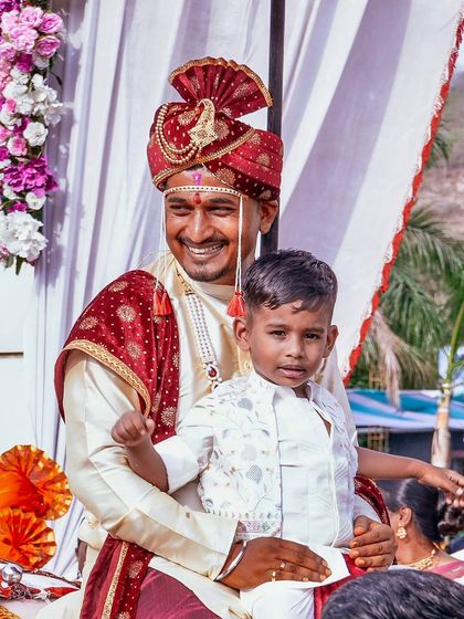 Every wedding is a collection of beautiful moments, big and small. This heartwarming shot of the groom with a young family member captures the joy that fills the air, all set against the backdrop of our thoughtfully planned decor.