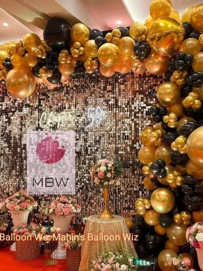 A close-up of the stunning balloon work and shimmer wall, showing the rich textures and colors that made this anniversary celebration so special.