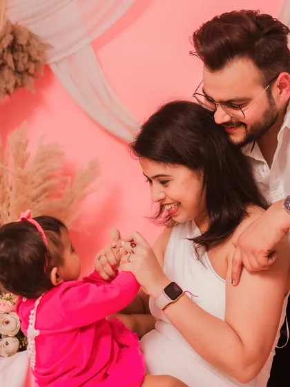 A playful moment between parents and their daughter. These are the fun, candid memories that you'll love.