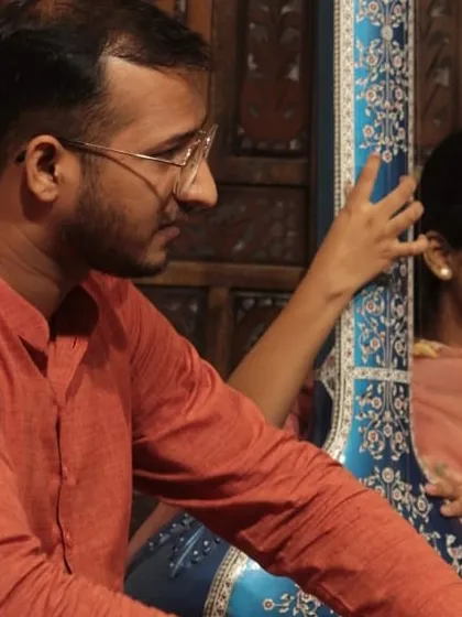 The Guru-Shishya Parampara is about direct transmission of knowledge. Here, I am guiding a young student in understanding the posture and connection with the tanpura, a foundational element of our classical music.