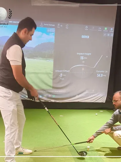 Here I am making a small adjustment to a client's setup. Even minor changes, when guided by data, can have a huge impact on ball flight and consistency.