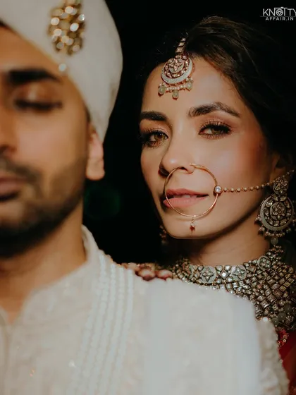 An intimate and artistic bridal portrait that focuses on the bride's expressive eyes and intricate jewelry. We aim to create iconic, magazine-worthy shots that highlight your unique beauty.