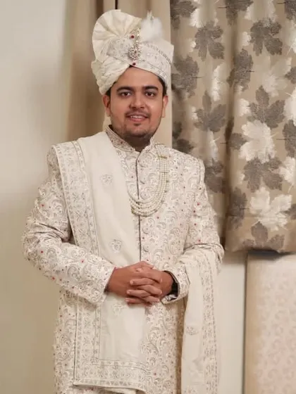 The groom standing confidently. My styling service ensures you are ready for your big day from head to toe.