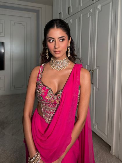 A gorgeous look featuring a hot pink saree. I paired it with soft smoked eyes and dewy skin for a balanced and stunning result.
