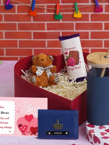 The same Love Keepsake Hamper, available in different colors. This blue version for him includes a personalized tumbler, mini wallet, teddy, chocolate, and a custom message card.