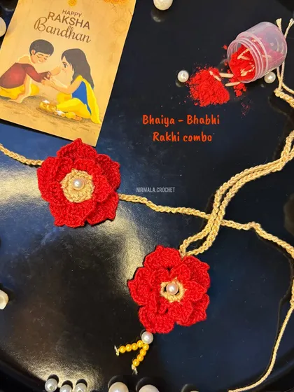 Celebrate your bond with our Bhaiya-Bhabhi Rakhi combo. This set features two beautifully coordinated floral rakhis, handcrafted with soft silk-blend threads for a comfortable and special feel.