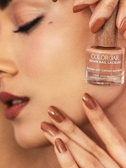 A close-up macro shot that emphasizes the flawless finish of the nail polish. My high-end retouching process ensures every detail is perfect, from the cuticle line to the reflection on the nail, while keeping the skin looking real.