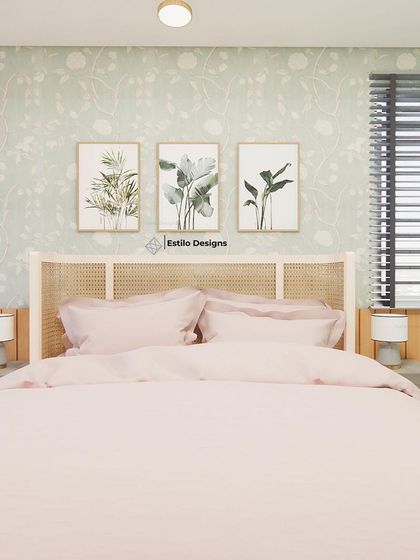For a client who loves her garden, I brought the outdoors in with this English cottage inspired master bedroom. The design features a floral wallpaper, a distressed cane headboard, and a soft color palette to create a space that reflects her personality.
