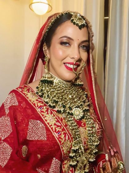 My bride Shraddha looked like royalty on her wedding day. Her look was classic and timeless, with a bold red lip and stunning jewelry.