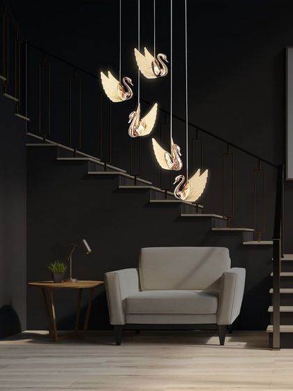 Here, the swan chandelier is shown in a staircase setting. The cascading design is ideal for such spaces, drawing the eye upward.