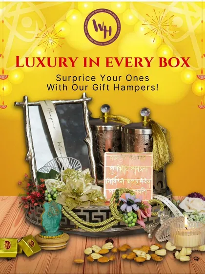 Luxury in every box. This premium Diwali hamper features a silver photo frame, ornate copper-finished jars, and a scented candle, all arranged on a decorative tray for a truly elegant and memorable gift.