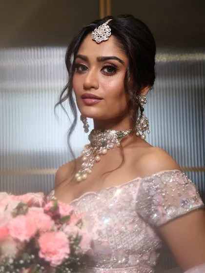 A dreamy, romantic look perfect for an engagement or reception. The soft pink tones and glowing skin are hallmarks of my signature style.