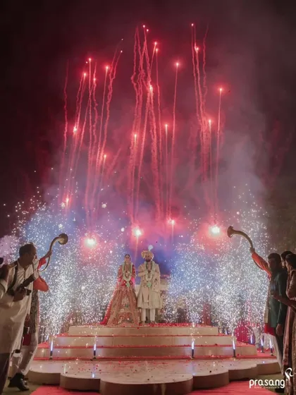 I believe every union deserves a grand beginning. This shot captures the pinnacle of celebration, where I coordinate spectacular fireworks and dramatic lighting to create a breathtaking, unforgettable moment for the couple and their guests.