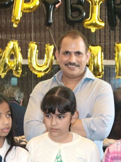 The birthday host surrounded by young guests. I capture the community feel of your celebration by including friends and family in the shots.