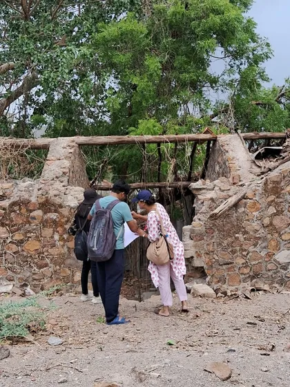 Examining the dilapidated stone walls of the Darbargarh with my team, documenting the structure as the first step towards its revival.