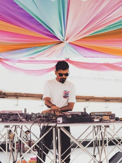 Spinning at a rooftop Holi party. The colorful canopy and open-air setting created a perfect vibe for the festival of colors.