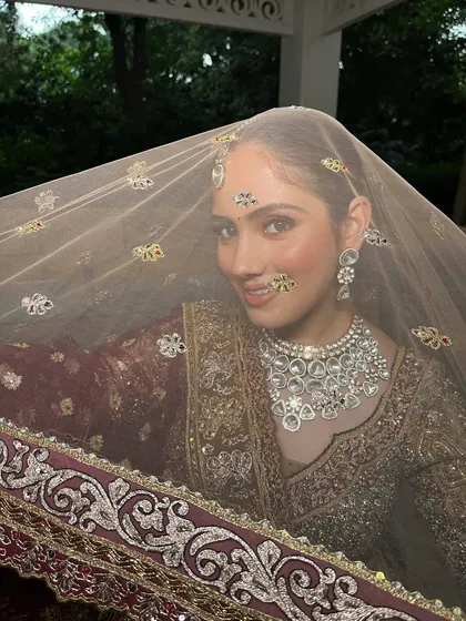 My philosophy is to never age you with makeup. This look is soft, minimal, and elegant, captured beautifully through a delicate veil for an ethereal feel.