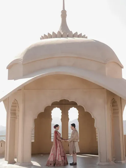 A silhouette of love against a backdrop of heritage. I positioned the couple within this rooftop cupola to create a timeless, symmetrical portrait that speaks to their shared journey, framed by the sky and ancient architecture.