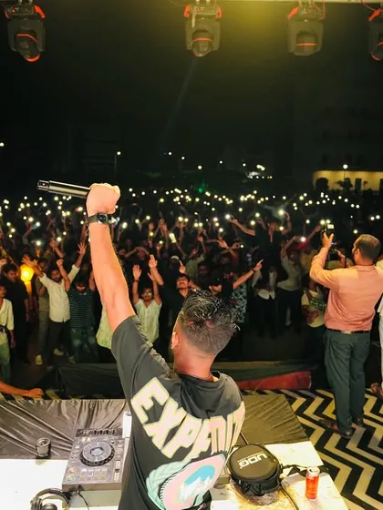 A wider angle of the crowd at IIT Indore, with everyone's hands and phone lights up. It's a powerful image of unity and shared experience.