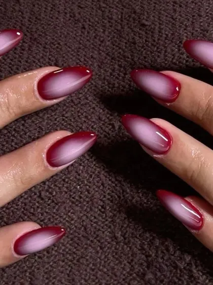 Obsessed with the aura nail trend. This set shows a deep red aura effect, blending from a dark border to a bright center. It's a super trendy and mesmerizing look that we can create in any color you love.