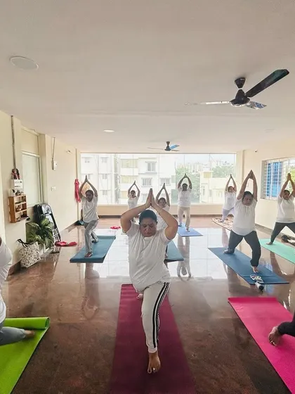 Students holding Warrior I pose, showing strength and determination. I love seeing the different expressions of the same asana, each one perfect for that individual's body.