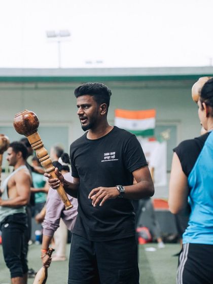 A coach passionately explains a technique during an L1 Certification session. Our programs are led by knowledgeable and friendly instructors who are dedicated to sharing the science behind these movements.