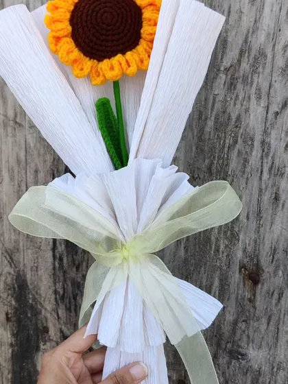 Sometimes, a single flower is all you need to brighten someone's day. This single crochet sunflower is beautifully wrapped to create a simple yet heartfelt bouquet of sunshine for your companion.