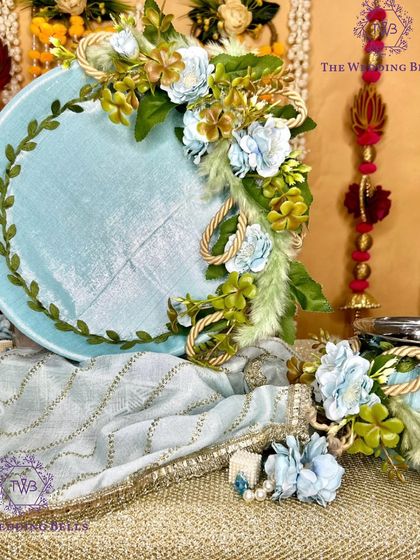 The complete ice blue floral Karwachauth thali set, showcasing the beautiful arrangement on the platter and the matching decorated lota.