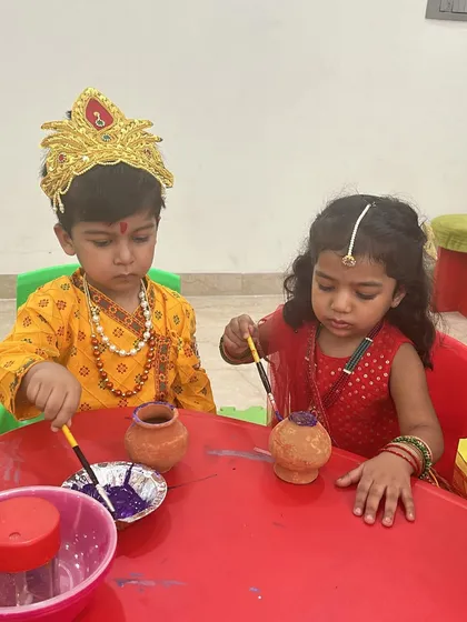 Little Krishnas and Radhas getting creative. During our Janmashtami event, children dressed in traditional costumes and had a wonderful time painting their own matkis (pots).
