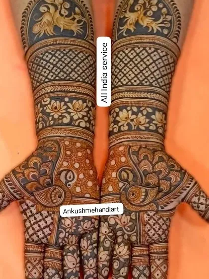 A vibrant design with golden-hued peacocks on the arms and intricate paisley patterns on the palms.