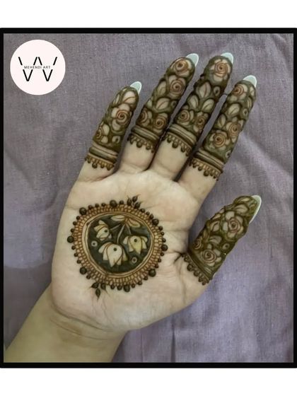 Another variation of the lotus bud mandala, with detailed rose patterns on the fingers.