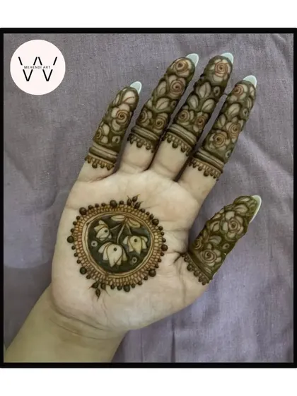 Another variation of the lotus bud mandala, with detailed rose patterns on the fingers.