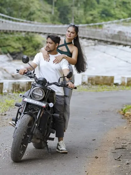 For the adventurous souls, a pre-wedding shoot in the mountains is an unforgettable experience. Here we are in Uttarakhand, using the winding roads and a classic bike to tell a story of a journey they're taking together.