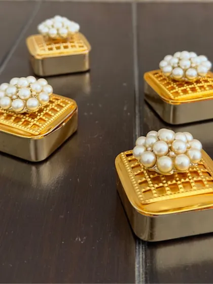 I love these classic square metal coin boxes, topped with a cluster of pearls. They have a timeless appeal and are a wonderful, reusable gift for your guests.