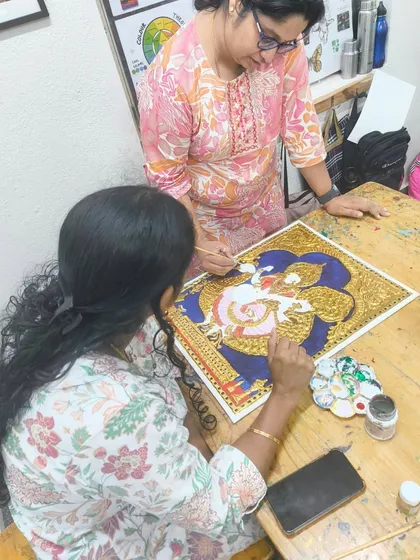 Here I am providing one on one guidance during a Tanjore painting session. Our small batch sizes ensure every student gets personalized attention to help them navigate intricate techniques and bring their artistic vision to life.