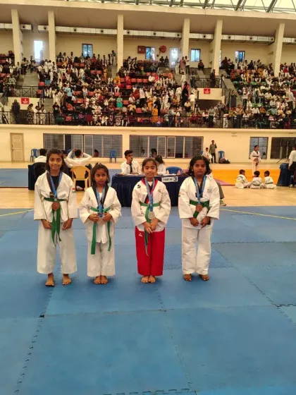 Our talented female students proudly displaying their medals after a successful competition. They are strong, skilled, and ready for any challenge.