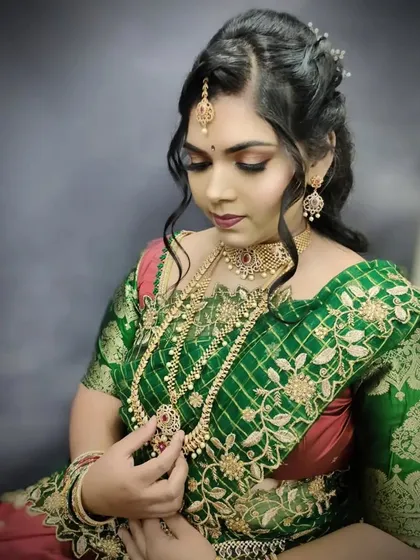 The complete look for a festive event, combining traditional attire with modern, glamorous makeup and hair.