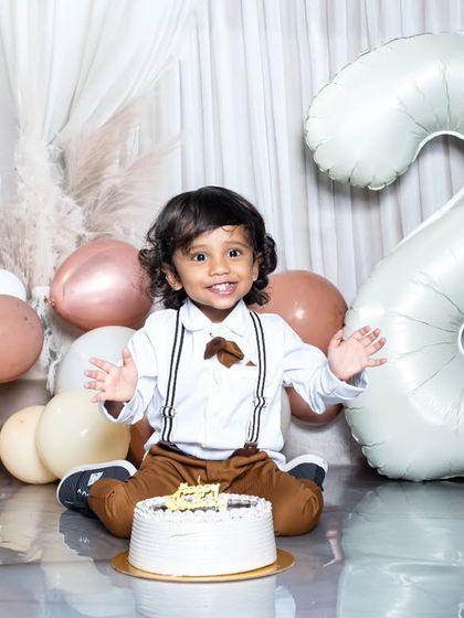 All smiles for his second birthday! This little boy is ready to celebrate.