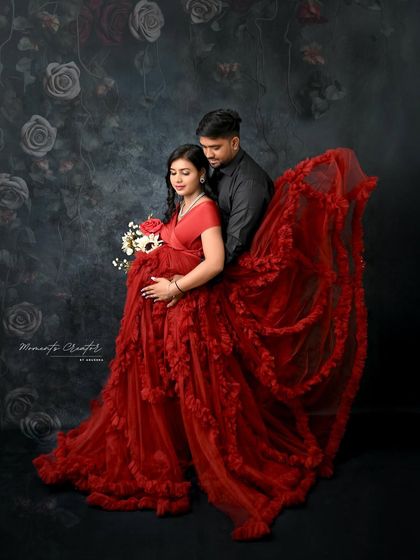 The partner’s embrace adds a layer of intimacy and support. This shot showcases how I use posing and the flow of the gown to create a romantic and dramatic couple's portrait.