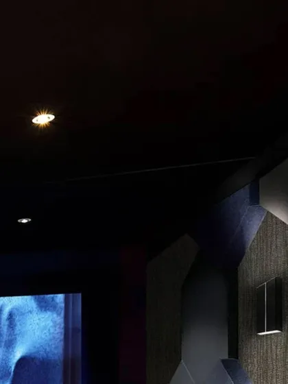 A closer look at the design elements of our "Entertainment Reimagined" concept. Notice the textured wall panels for acoustic treatment, the precise placement of recessed ceiling lights, and the comfortable, fabric-upholstered cinema seats.